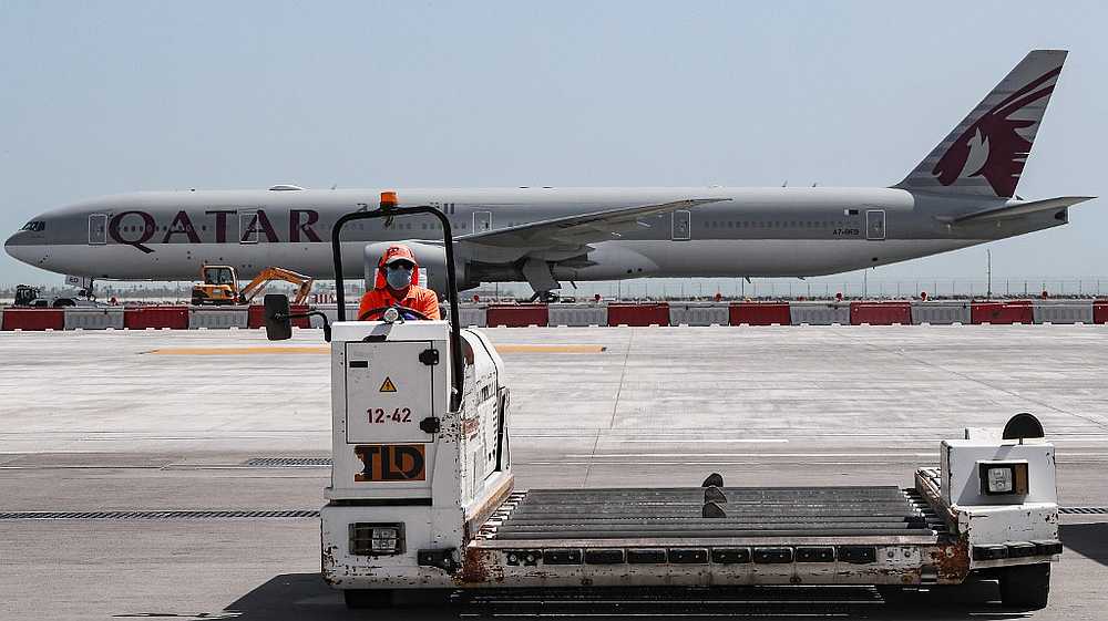 A Qatar Airways Boeing 777 aircraft is seen behind a luggage trolley at Hamad International Airport in Doha April 1, 2020.  u00e2u20acu201d AFP pic
