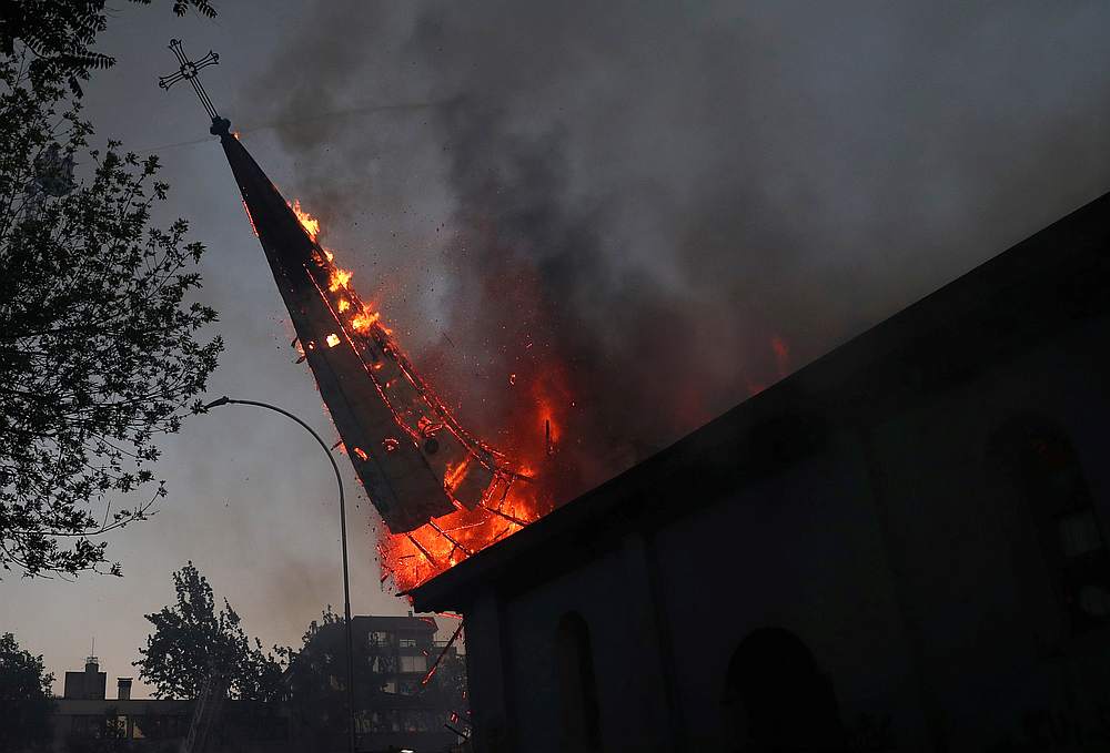 Churches burned as Chileans mark 1st year of protests