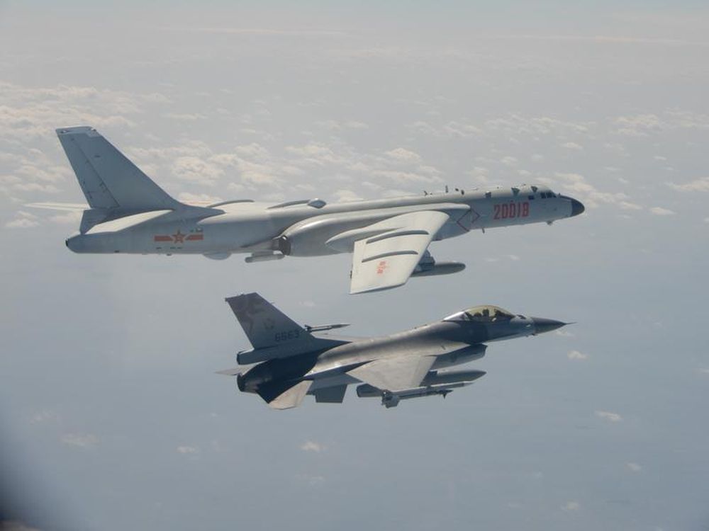 An H-6 bomber of Chinese PLA Air Force flies near a Taiwan F-16 in this February 10, 2020 handout photo provided by Taiwan Ministry of National Defense. u00e2u20acu201d Taiwan Ministry of National Defense/Handout pic via Reuters