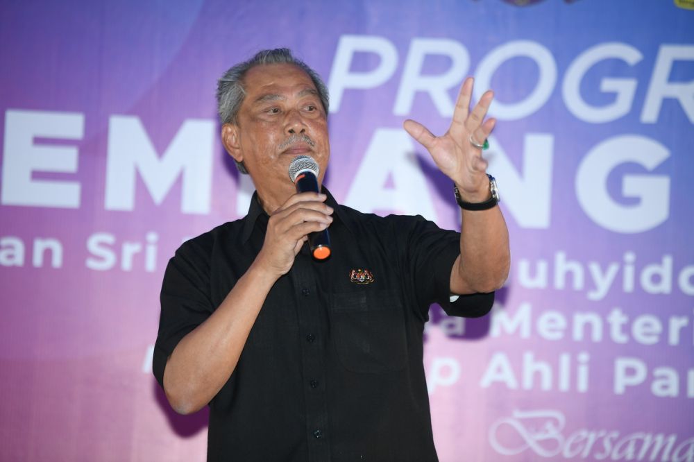 Prime Minister Tan Sri Muhyiddin Yassin delivers a speech during a meet-and-greet event at a restaurant in Pagoh October 30, 2020. — Bernama pic