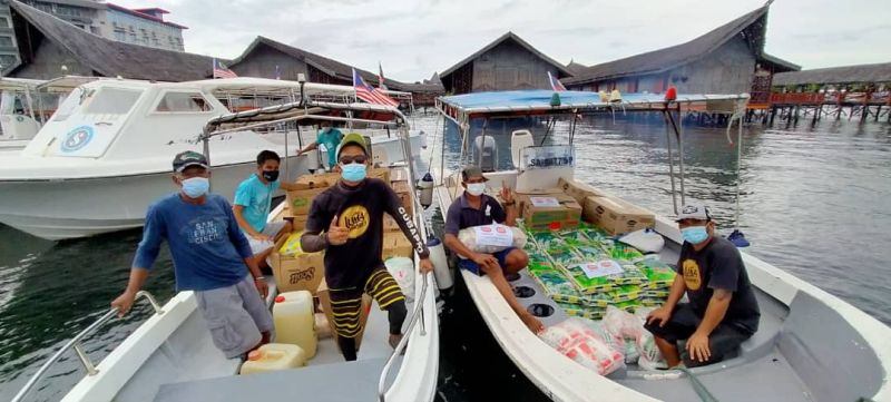 Semporna Heroes, a coalition of some 20 NGOs, have been sending rescue food packs and milk to local Bajau Laut communities who live on floating communities out at sea.— Picture courtesy of Semporna Heroes