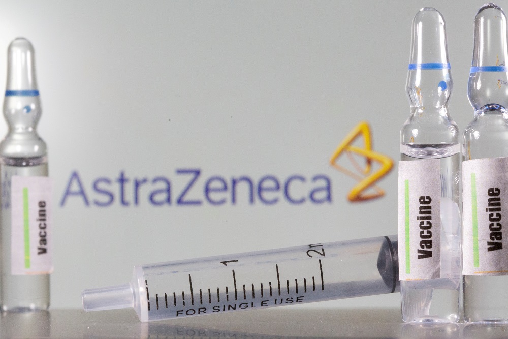 A test tube labelled with the word Vaccine is seen in front of AstraZeneca logo in this illustration taken September 9, 2020. u00e2u20acu201d Reuters pic