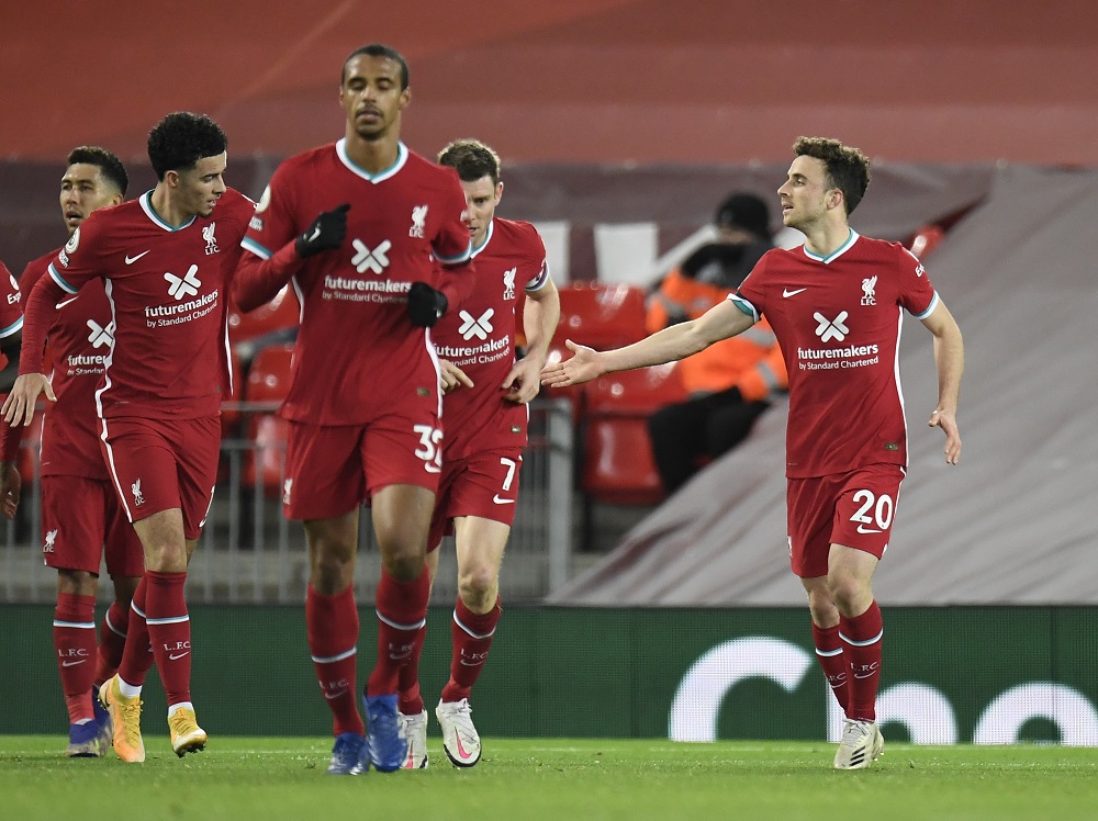 Liverpoolu00e2u20acu2122s Diogo Jota celebrates scoring their second goal with teammates during the match against Leicester City at Anfield in Liverpool November 22, 2020. u00e2u20acu201d Pool pic via Reuters 
