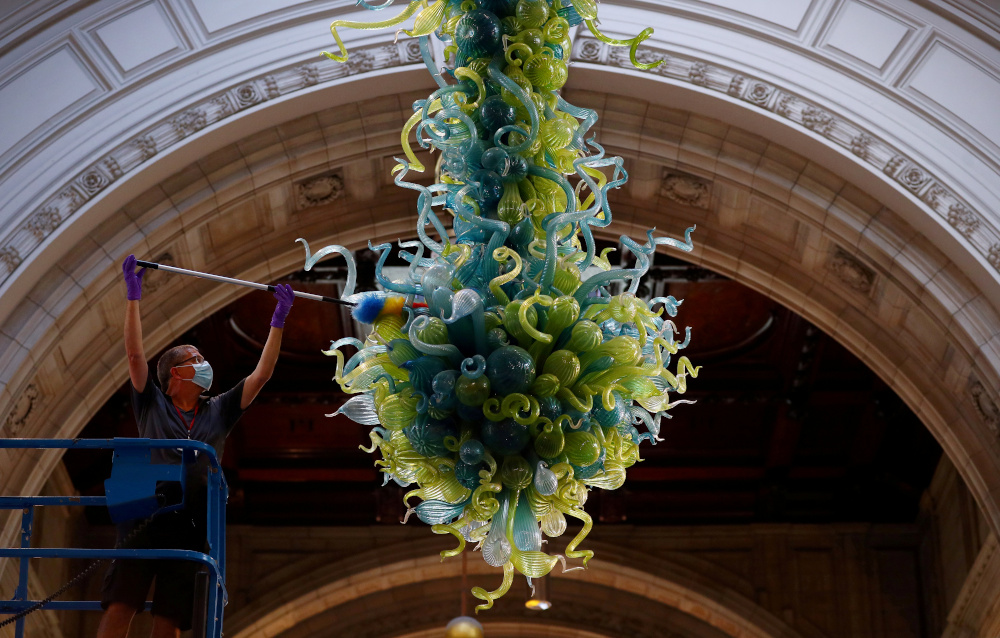 A museum technician cleans the V&A Rotunda Chandelier by Dale Chihuly during preparations to reopen the Victoria & Albert (V&A) Museum, after the outbreak of the coronavirus disease caused its closure, in London, Britain, August 4, 2020. u00e2u20acu201d Reuters picnn