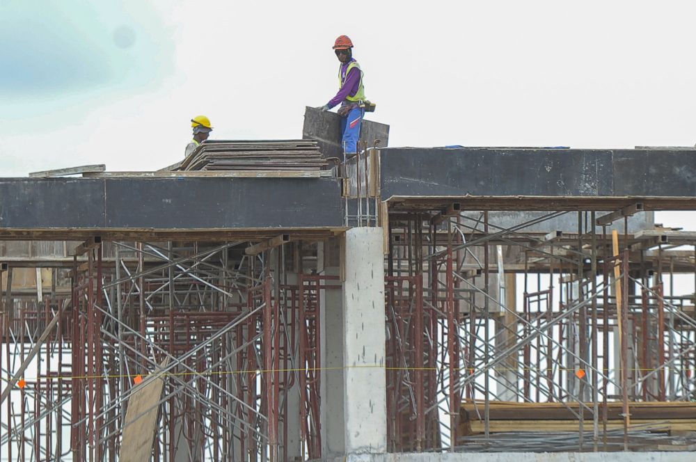 Workers are pictured at a construction site in Kuala Lumpur November 5, 2020. u00e2u20acu201d Picture by Shafwan Zaidon