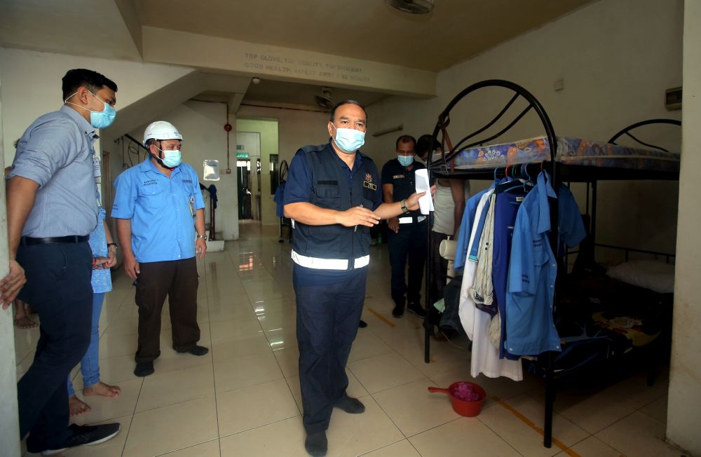 Officers from the Labour Department conduct checks on a workeru00e2u20acu2122s hostel in Tasek, Ipoh November 26, 2020. u00e2u20acu201d Picture by Farhan Najib