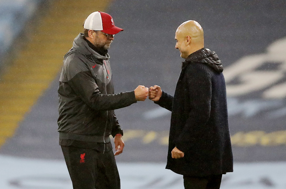 Manchester City manager Pep Guardiola and Liverpool manager Jurgen Klopp bump fists after the Premier League match at Etihad Stadium, Manchester Martin November 8, 2020. u00e2u20acu201d Picture by Rickett /Pool via Reuters 