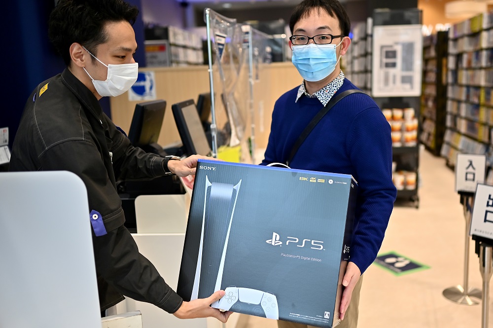 A customer buys the new Sony PlayStation 5 gaming console on the first day of its launch, at an electronics shop in Kawasaki, Kanagawa prefecture on November 12, 2020. u00e2u20acu2022 AFP pic