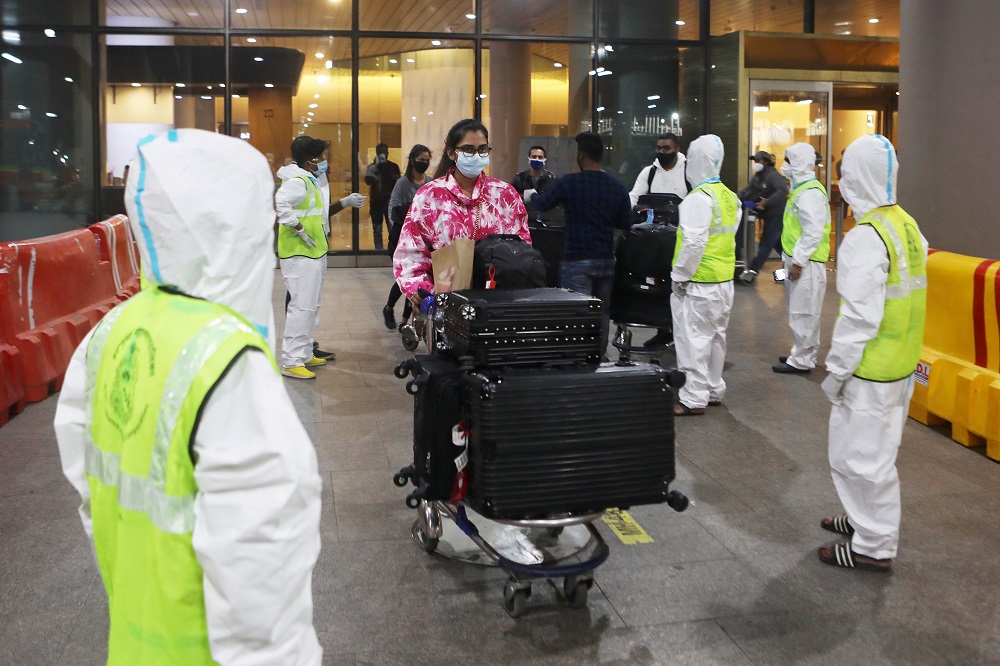 Passengers wearing protective face masks leave upon arrival at Chhatrapati Shivaji Maharaj International Airport after India cancelled all flights from the UK over fears of a new variant of the Covid-19 in Mumbai December 22, 2020. u00e2u20acu2022 Reuters pic