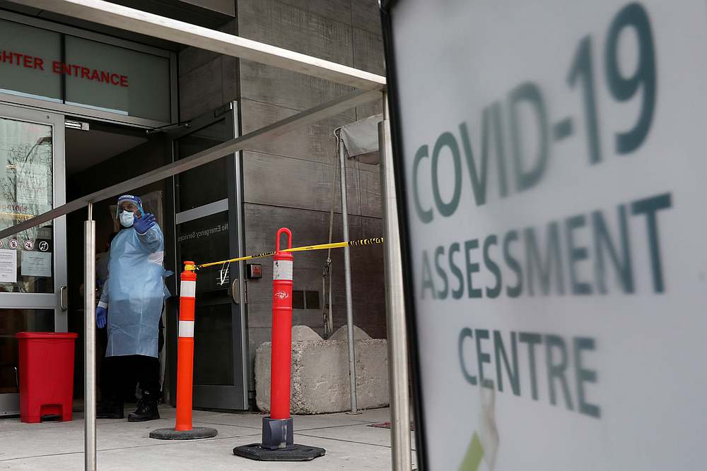A nurse guides people being tested for Covid-19 outside a hospital in Toronto, Ontario, Canada December 10, 2020. u00e2u20acu201d Reuters pic