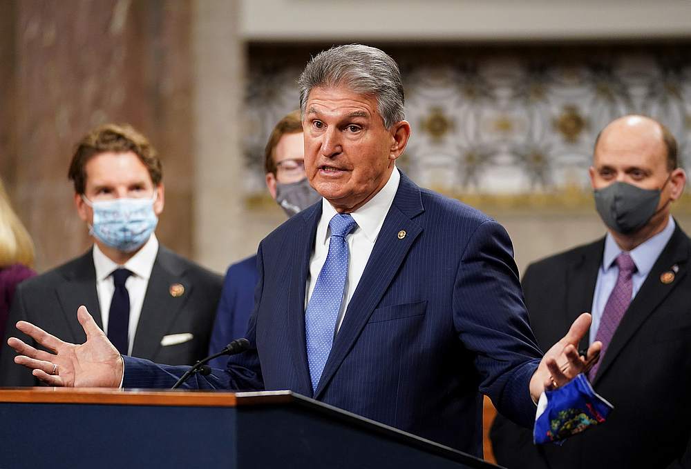 US Senator Joe Manchin removes his mask to speak as bipartisan members of the Senate and House gather to announce a framework for fresh Covid-19 relief legislation on Capitol Hill in Washington December 1, 2020. u00e2u20acu201d Reuters pic