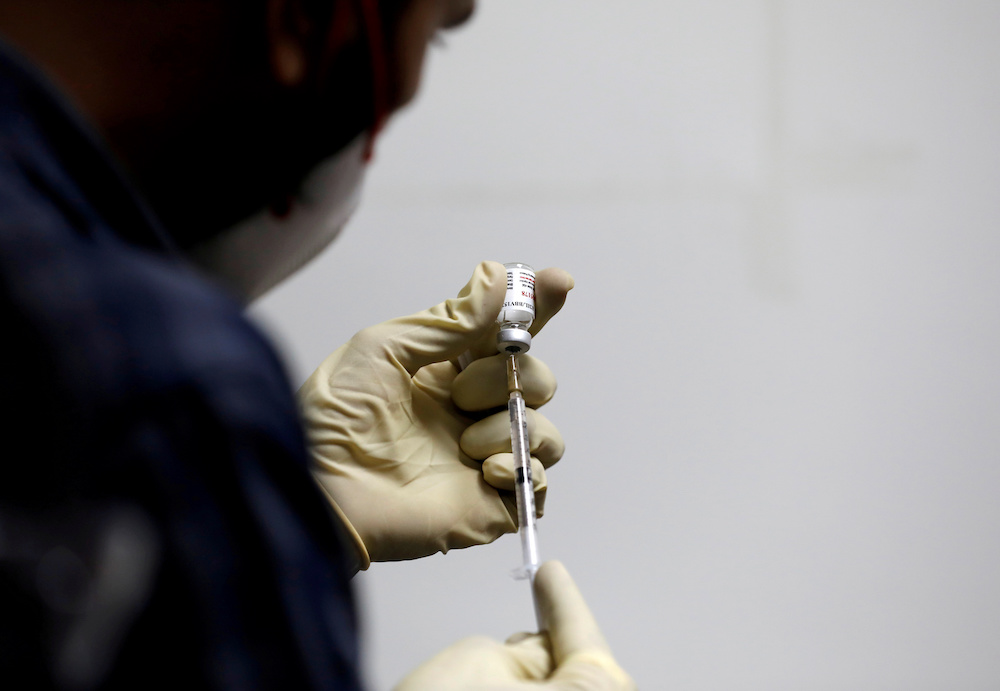 The revelation that the largest allocation of doses India has supplied to the Covax programme never actually left the country could add to criticism of India and Covax. — Reuters pic