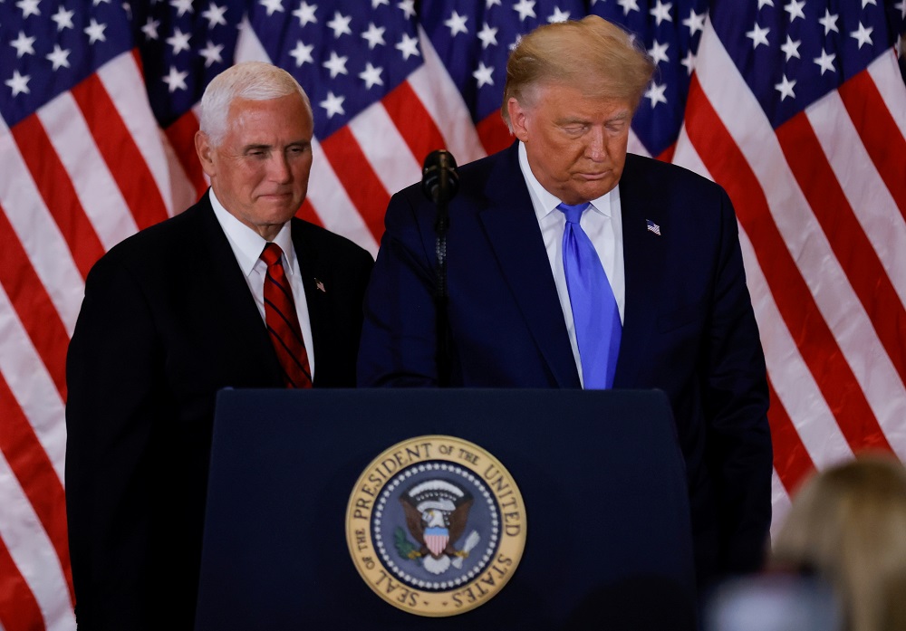 US President Donald Trump and Vice President Mike Pence stand while making remarks about early results from the 2020 US presidential election in the East Room of the White House in Washington November 4, 2020. u00e2u20acu201d Reuters pic