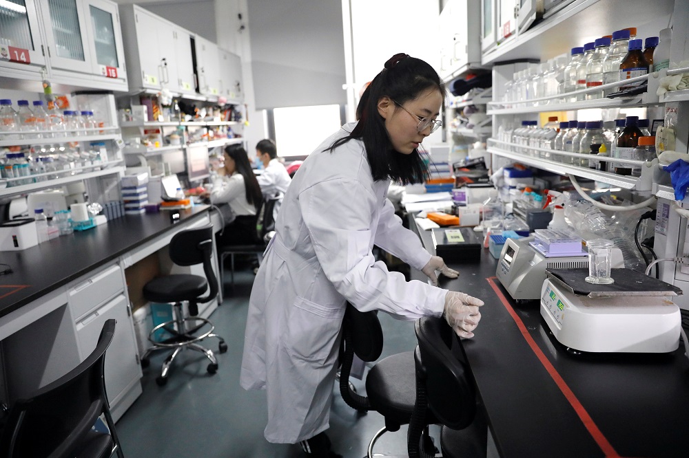 Dr Shuhui Sun performs histological staining of mouse liver for pathological analysis in the Ageing and Regeneration lab at the Institute for Stem Cell and Regeneration of the Chinese Academy of Sciences (CAS) in Beijing January 12, 2021. — Reuters pic