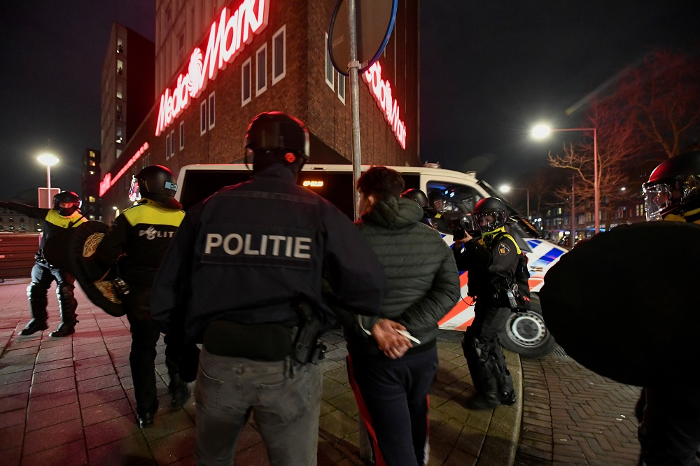 Police officers detain a demonstrator protesting against restrictions put in place to curb the spread of the coronavirus disease in Rotterdam January 26, 2021. u00e2u20acu201d Reuters pic