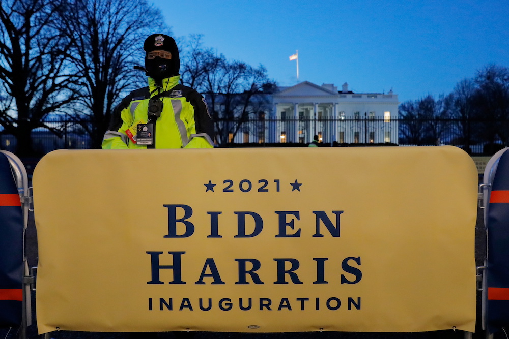 An officer of the Metropolitan Police Department of Washington DC, stands guard in front of the White House, ahead of the inauguration of Joe Biden as US President in Washington January 20, 2021. — Reuters pic