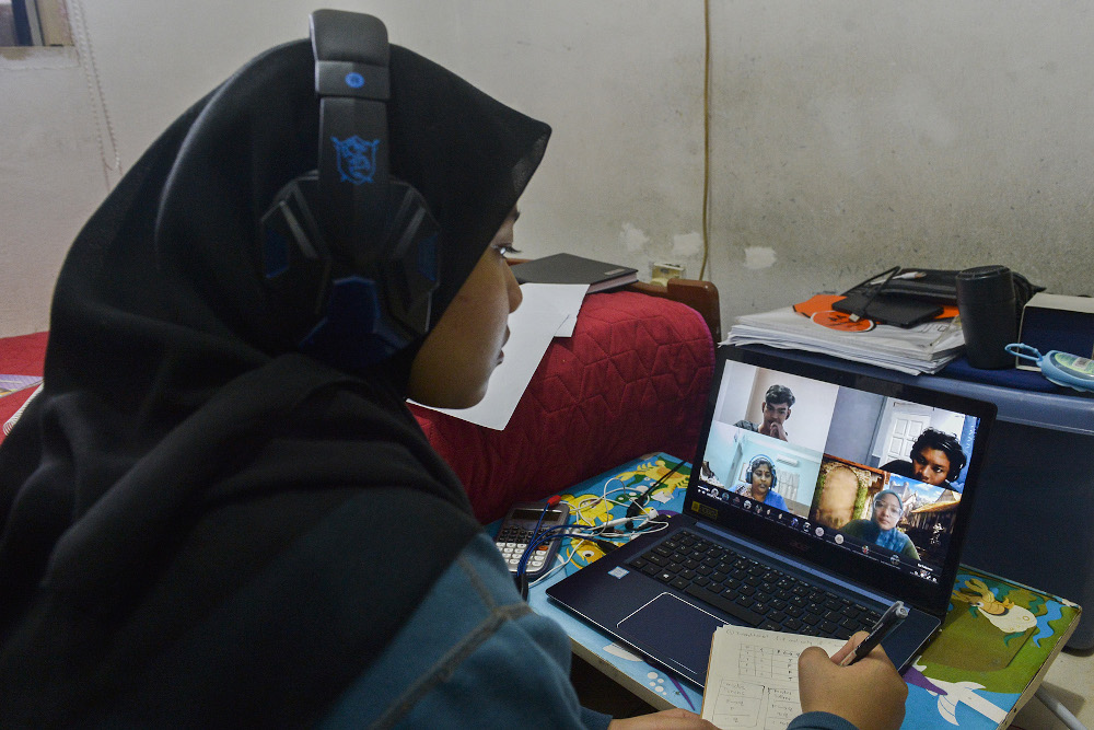 A student attends an online lesson from home during movement control order in Petaling Jaya on January 26, 2021. — Picture by Miera Zulyana