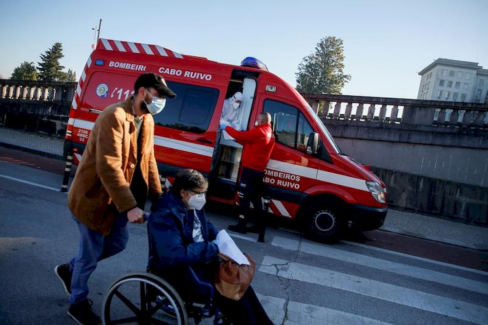 An ambulance carrying a Covid-19 patient is seen outside Santa Maria Hospital, during the coronavirus disease (Covid-19) pandemic in Lisbon, Portugal, January 18, 2021. — Reuters pic