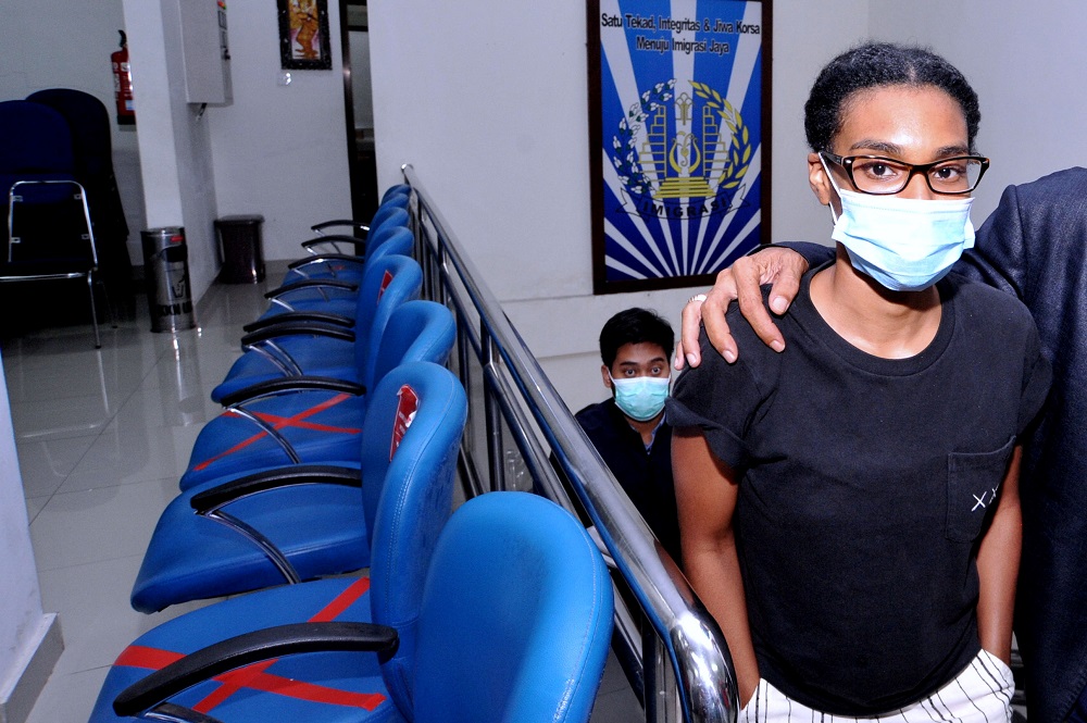 An American woman and self-described digital nomad Kristen Gray looks on after being examined at the Indonesian Immigration office in Denpasar, Bali January 19, 2021 in this photo taken by Antara Foto. u00e2u20acu2022 Antara Foto pic via Reuters  