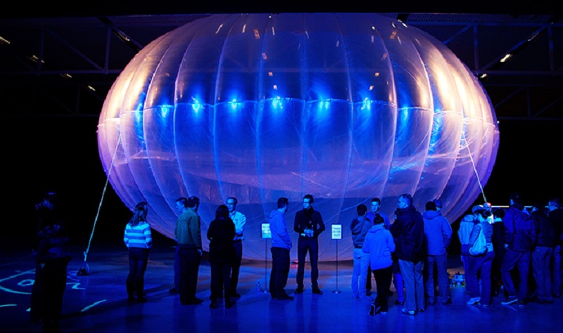 Visitors stand next to a high altitude WiFi internet hub, a Google Project Loon balloon, on display at the Airforce Museum in Christchurch on June 16, 2013. u00e2u20acu2022 AFP pic