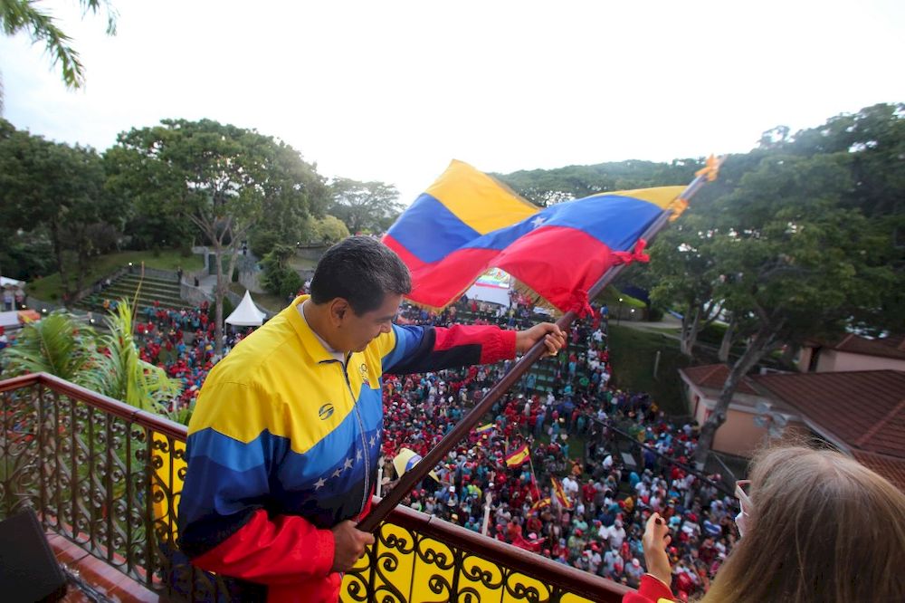 Venezuelau00e2u20acu2122s President Nicolas Maduro waving the Venezuelan national flag during a meeting to commemorate the 63rd Anniversary of the Popular Insurrection of January 23, 1958, at Miraflores Presidential Palace in Caracas on January 23, 2021. u00e2u20acu201d AFP pic