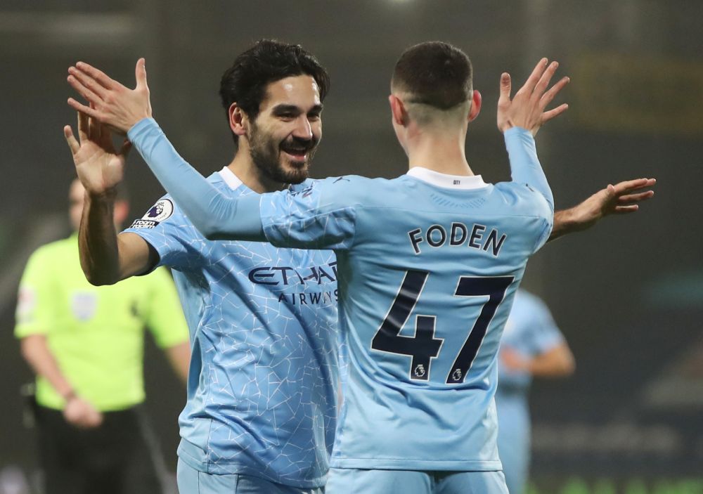 Manchester City's Ilkay Gundogan celebrates scoring their third goal against West Brom with Phil Foden at The Hawthorns, West Bromwich  January 26, 2021. u00e2u20acu201d Reuters pic