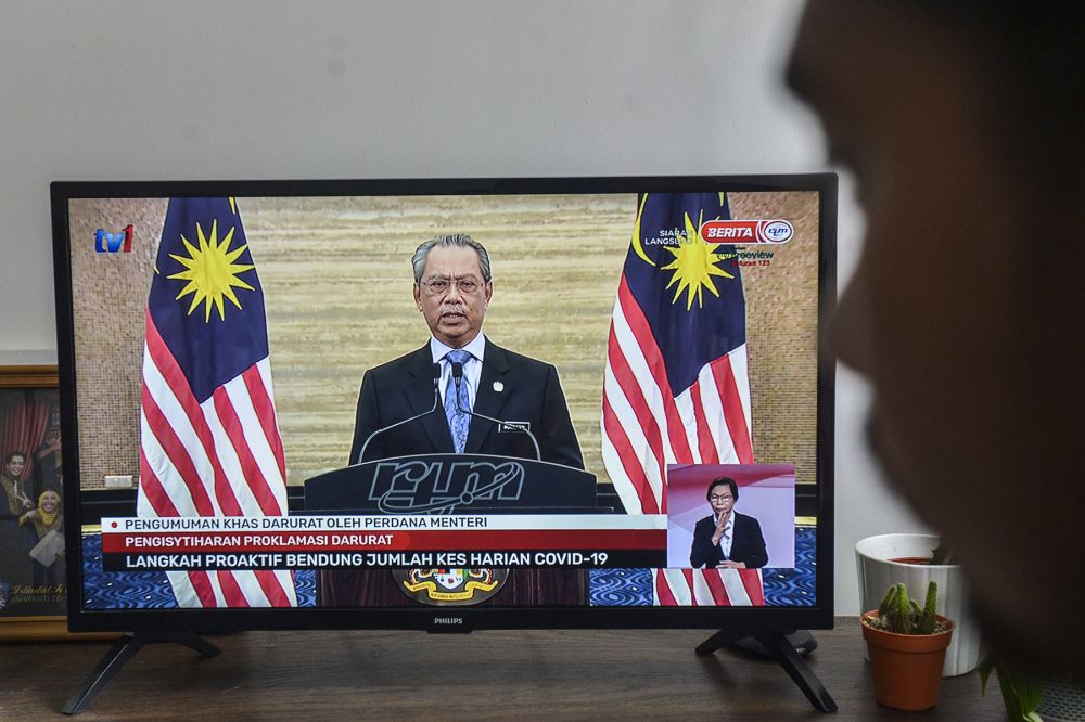 A man watches a live telecast of Prime Minister Tan Sri Muhyiddin Yassin's speech in Kuala Lumpur January 12, 2020. u00e2u20acu201d Picture by Miera Zulyana