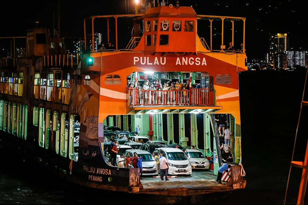 Passengers and vehicles on board Pulau Angsa the ferry after the journey from Pengkalan Raja Tun Uda to Pengkalan Sultan Abdul Halim January 1, 2020. u00e2u20acu2022 Picture by Sayuti Zainudin