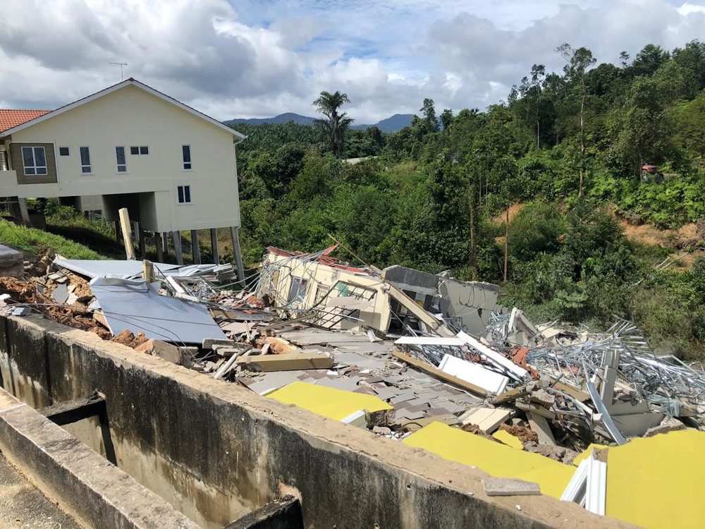 Two houses in Taman Gambang Damai in Kuantan collapsed, believed to be due to hillslope soil movements as a result of continuous rain January 5, 2021. u00e2u20acu201d Picture via Twitter/Bernama 