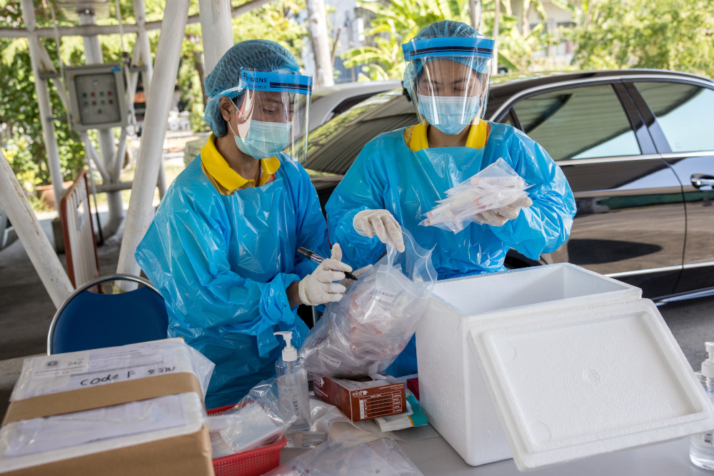 Medical workers wearing personal protective equipment (PPE) collect PCR Covid-19 coronavirus test samples at the Urban Institute for Disease Prevention and Control in Bangkok January 11, 2021. u00e2u20acu201d AFP picn