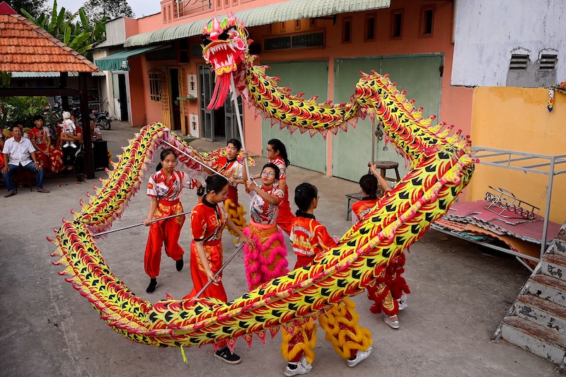This photograph taken on January 20, 2021 shows Le Yen Quyen (centre) practising a dragon dance routine along with other female dancers at the Tu Anh Duong lion and dragon dance school in Can Tho city in southern Vietnam's Mekong Delta. u00e2u20acu201d AFP pic