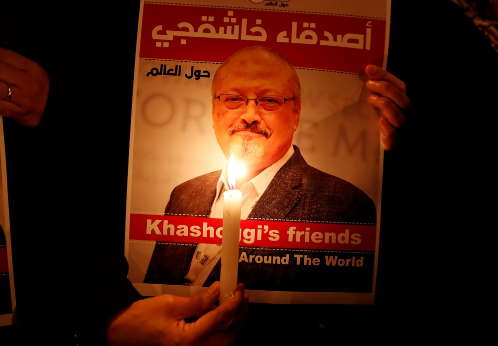 A demonstrator holds a poster with a picture of Saudi journalist Jamal Khashoggi outside the Saudi Arabia consulate in Istanbul October 25, 2018. — Reuters pic