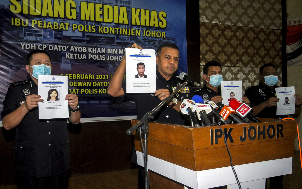 Johor Police Chief Datuk Ayob Khan Mydin Pitchay (centre) with deputy Johor police chief Datuk Khaw Kok Chin (left) showing pictures of suspects at thei Johor Police headquarters in Johor Bahru, Feb 6, 2021. u00e2u20acu201d Reuters pic