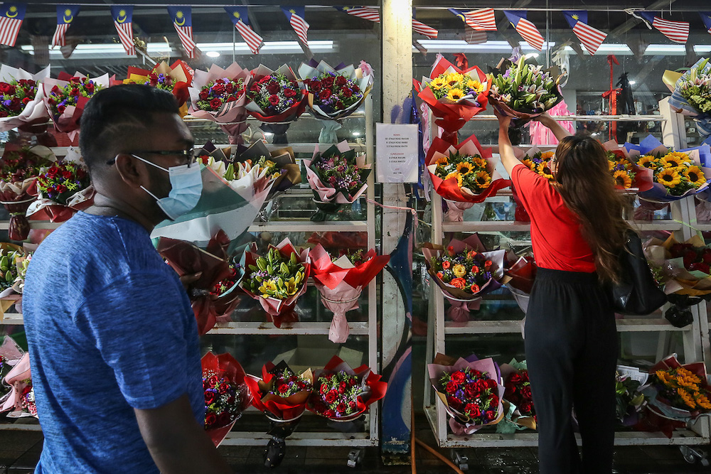 People shop for flower bouquets ahead of Valentine's Day in Kuala Lumpur February 13, 2021. u00e2u20acu201dPicture by Yusof Mat Isa