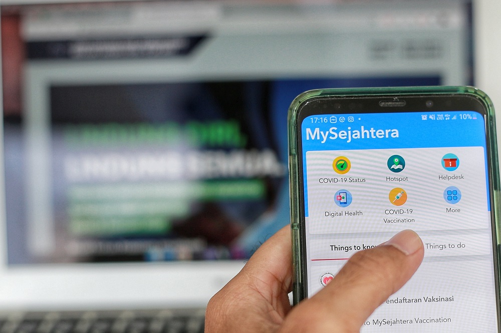 The section for Covid-19 vaccination registration via the MySejahtera mobile application is displayed on a mobile phone in Kuala Lumpur February 24, 2021. u00e2u20acu201dPicture by Ahmad Zamzahuri