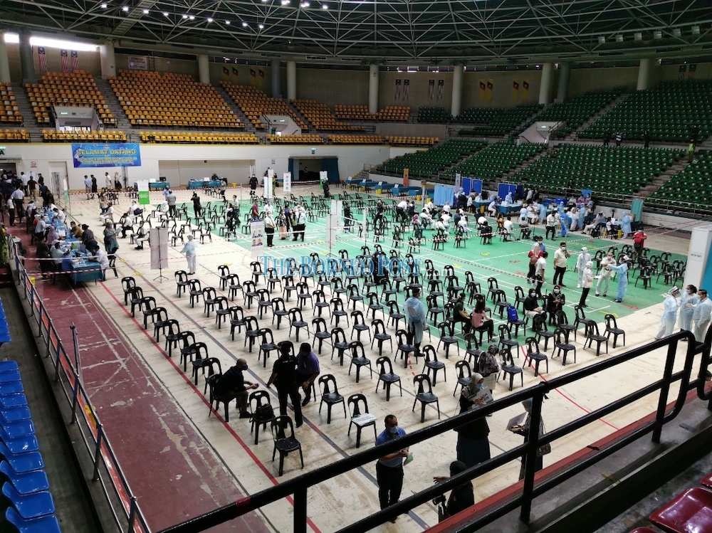 Healthcare workers preparing to open the Stadium Perpaduan, Petra Jaya in Kuching for the first phase of the Sarawak Covid-19 Vaccination Programme which will last until March 31. u00e2u20acu201d Photo by Roystein Emmor/Borneo Post Online