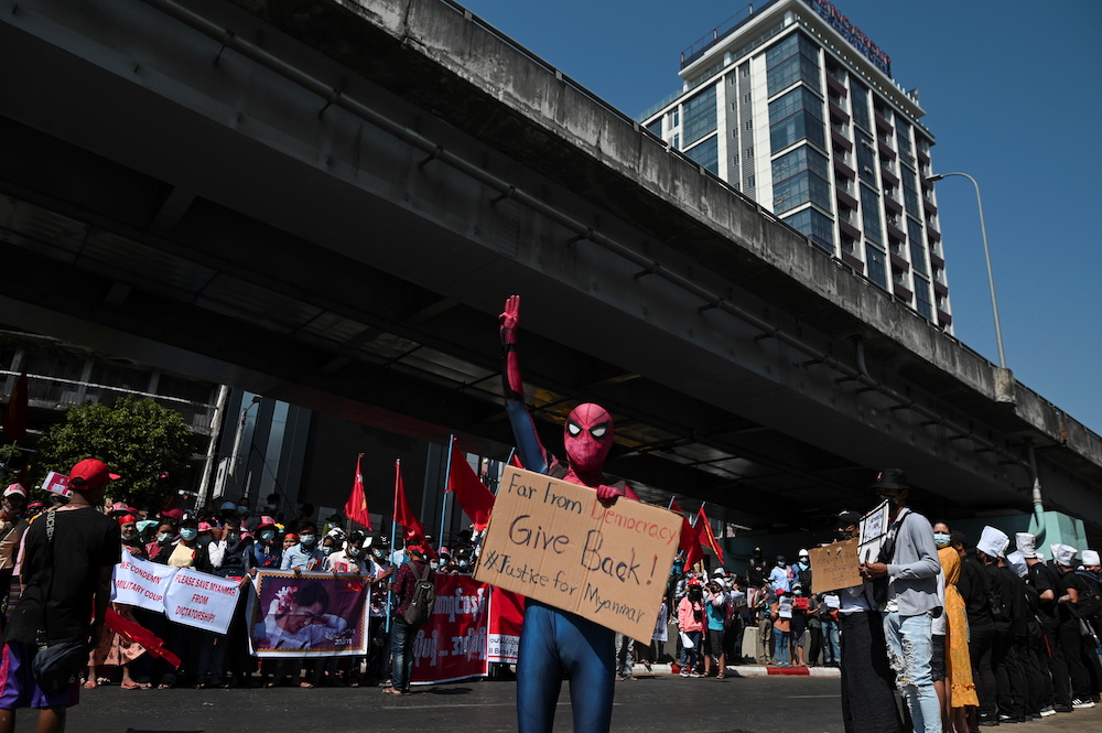 A protestor wearing a Spiderman costume gives the three-finger salute as he rallies against the military coup and to demand the release of elected leader Aung San Suu Kyi, in Yangon, Myanmar, February 10, 2021.u00e2u20acu201d Reuters picnnnn