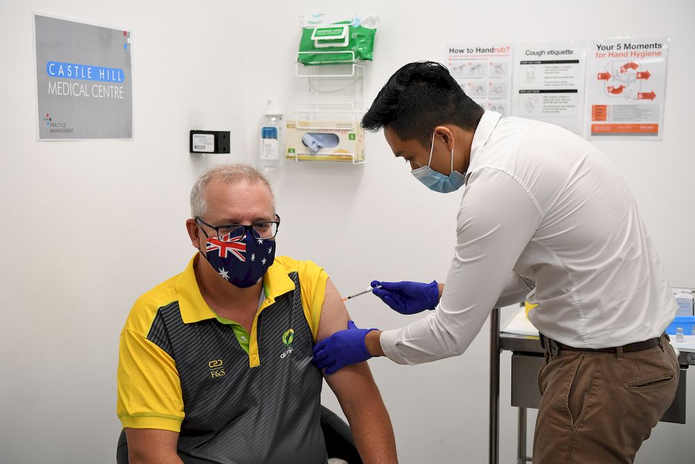 Australian Prime Minister Scott Morrison receives his Covid-19 vaccination during a visit to Castle Hill Medical Centre to preview the Covid-19 vaccination program, February 21, 2021. — AAP Image/Joel Carrett via Reuters