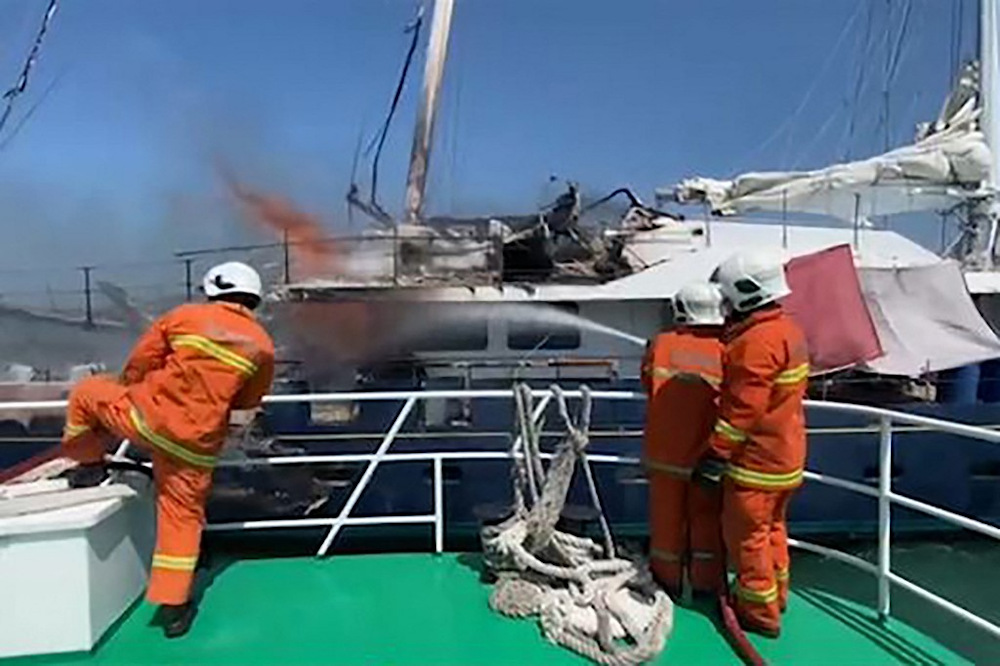 This screengrab from a video taken and released on February 18, 2021 by the Malaysian Maritime Enforcement Agency shows rescuers putting out a fire on a yacht named u00e2u20acu02dcPhoceau00e2u20acu2122 in Langkawi. u00e2u20acu201d AFP pic