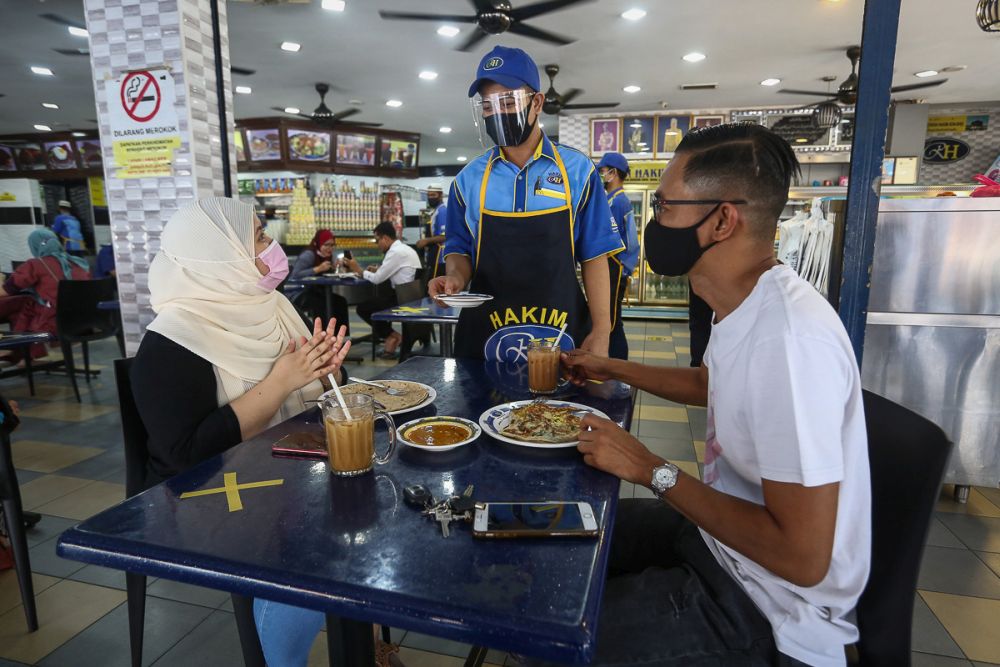 Patrons are seen dining in at Hakim Restaurant in Shah Alam February 10, 2021. u00e2u20acu201d Picture by Yusof Mat Isa