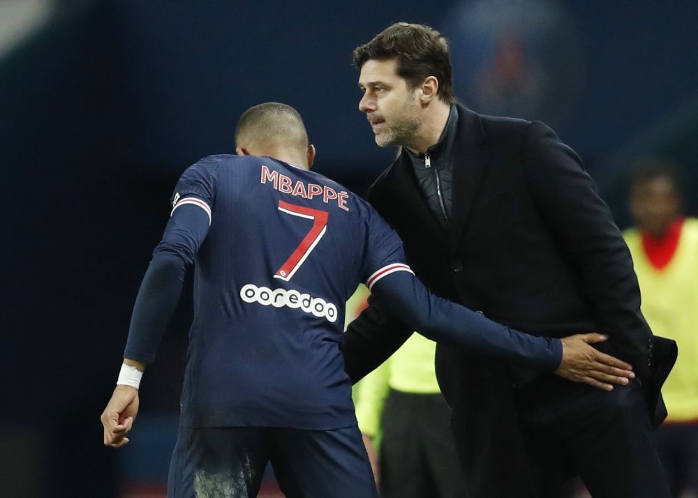 Paris St Germain's Kylian Mbappe celebrates scoring their third goal against Nimes with coach Mauricio Pochettino at Parc de Princes, Paris February 3, 2021. u00e2u20acu2022 Reuters pic