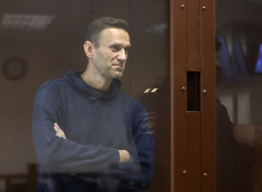 Alexei Navalny, who is accused of slandering a Russian World War Two veteran, stands inside a defendant dock before a court hearing in Moscow February 5, 2021. u00e2u20acu201d Picture by Press Service of Babushkinsky District Court of Moscow via Reuters