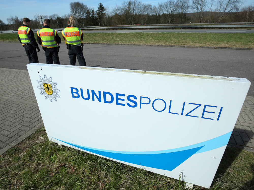 German police officers stand behind a sign that reads u00e2u20acu02dcFederal policeu00e2u20acu2122 during car checks at the border with France due to the spreading of the coronavirus disease (Covid-19) in Saarbruecken March 16, 2020. u00e2u20acu201d Reuters pic