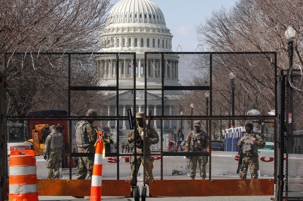 National Guard soldiers stand guard behind a security fence near the US Capitol after police warned that a militia group might try to attack the Capitol complex in Washington, US March 4, 2021. u00e2u20acu201d Reuters pic