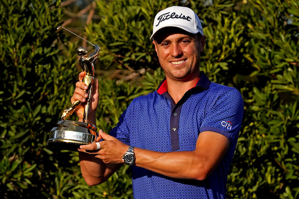 Justin Thomas celebrates with the trophy after winning The Players Championship golf tournament, March 14, 2021. u00e2u20acu201d Jasen Vinlove-USA TODAY Sports via Reuters