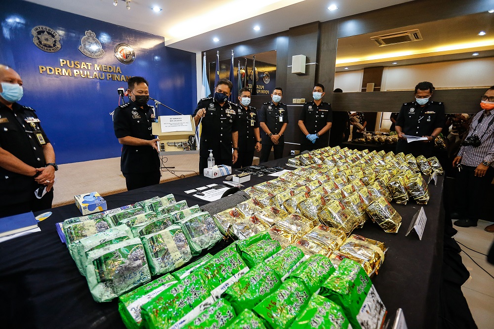 Penang police chief Datuk Sahabudin Abd Manan (third left) shows some of the items confiscated during the raid, at a press conference in George Town February 22, 2021. u00e2u20acu201d  Picture by Sayuti Zainudin