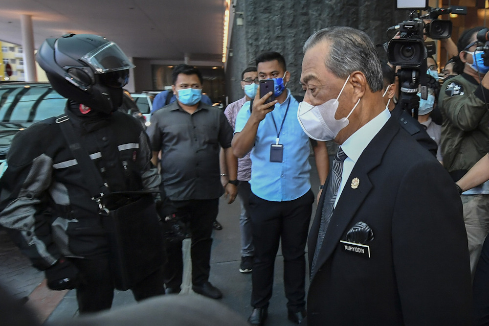 Tan Sri Muhyiddin Yassin leaves after chairing the Bersatu Supreme Council meeting at a hotel in Kuala Lumpur March 4, 2021. u00e2u20acu201d Bernama pic