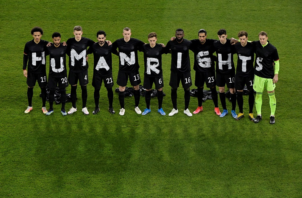 Germany players pose for a photo displaying a Human Rights message on their t-shirts before the match against Iceland March 26, 2021. u00e2u20acu2022 Pool via Reuters