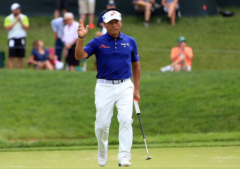 KJ Choi waves to the crowd on the 14th green during the second round of the 2019 Memorial golf tournament at Muirfield Village Golf Club May 31, 2019. — Reuters pic