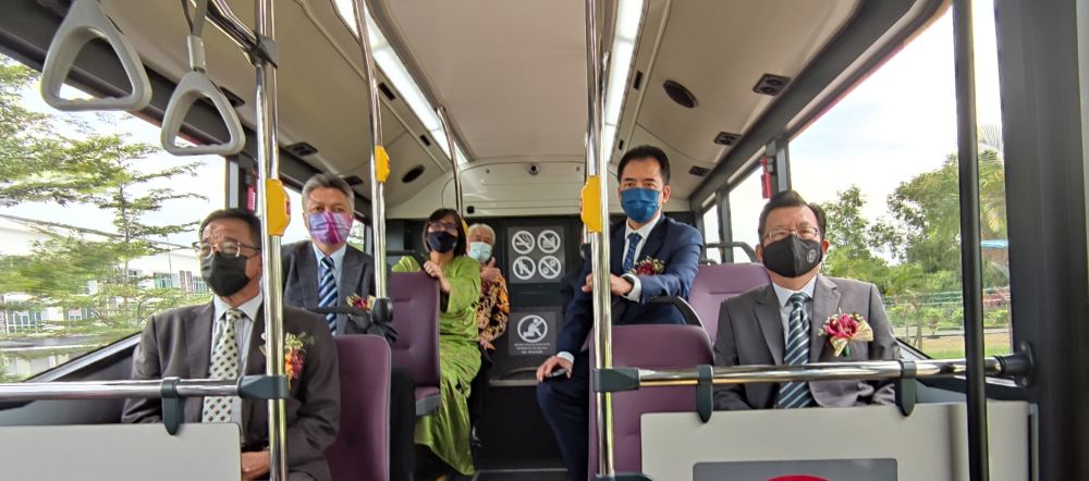 Sarawak Tourism, Arts, and Culture Minister Datuk Abdul Karim Rahman Hamzah (seated, left) aboard an electric bus after its launch in Kuching March 2, 2021. — Picture courtesy of the Sarawak Information Department